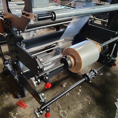 Side sealing bag machine unwinder